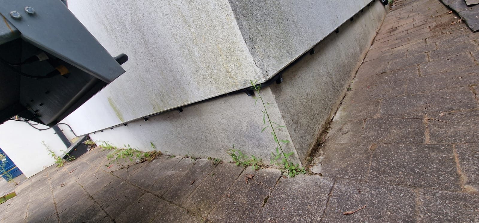 EV charger base unit installed on driveway
