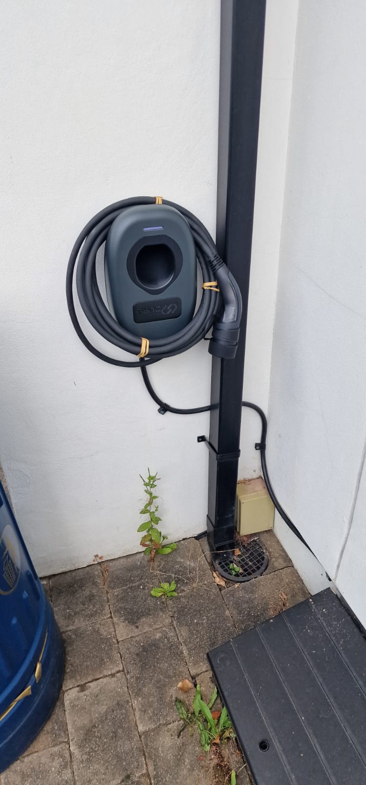 Wall-mounted EV charger with cable management in Cardiff